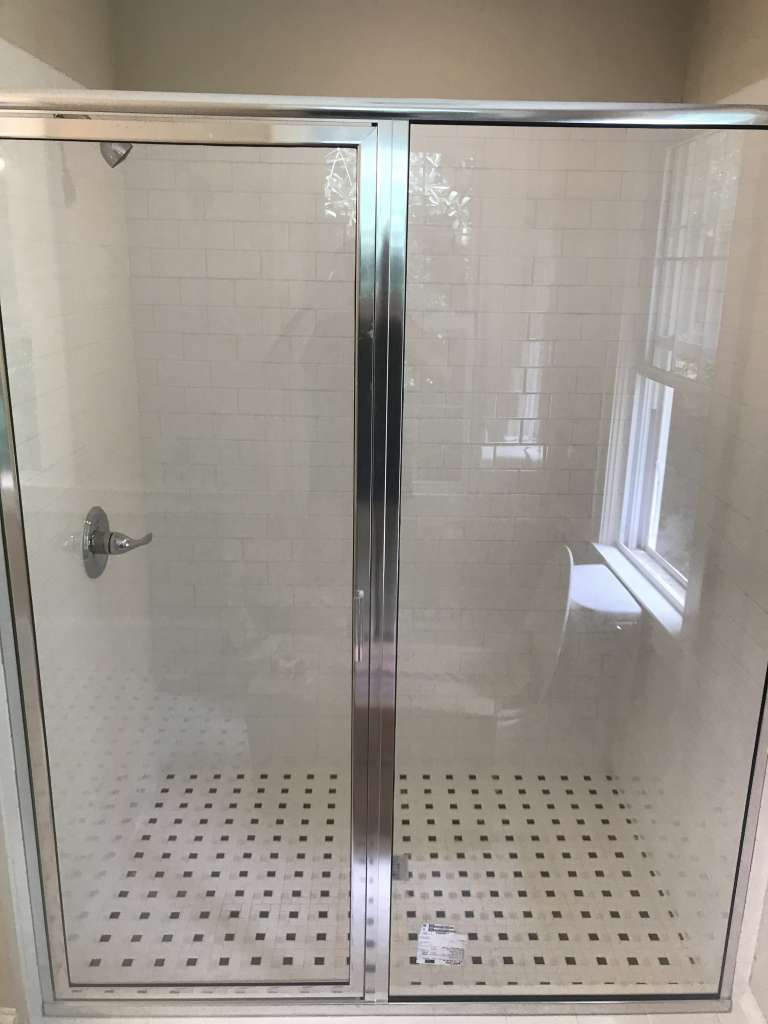 Tub and shower enclosure